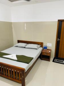 Postel nebo postele na pokoji v ubytování Asian Nest Serviced Apartments