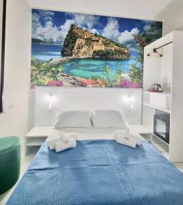 a bedroom with a painting of a island on the wall at DUOMO MIRADOIS 152 NAPOLI in Naples