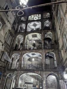 an old building with a bunch of balconies on the ceiling at DUOMO MIRADOIS 152 NAPOLI in Naples
