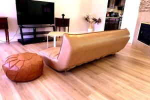 a couch sitting on the floor in a living room at Boho Haus - Three Bedrooms House in Las Vegas in Las Vegas