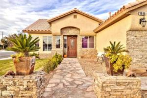 a house with a stone walkway leading to the front door at Boho Haus - Three Bedrooms House in Las Vegas in Las Vegas