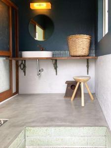 a bathroom with a sink and a stool at sikari Vacation STAY 95401v in Takashima