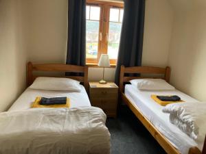 Ένα ή περισσότερα κρεβάτια σε δωμάτιο στο Sunbury Aviemore