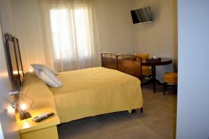 Postel nebo postele na pokoji v ubytování Il Trovatore Rooms