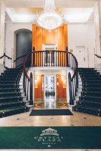 a staircase leading up to a large room with a staircase leading up to a at Crystal Plaza Hotel in Stockholm