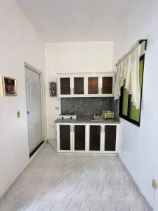 a kitchen with a sink and a counter top at YOUR SPACE COLONIAL in Santo Domingo