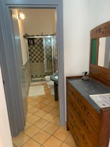 a bathroom with a shower and a toilet and a sink at Casa Marietta in Lipari