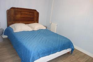 En eller flere senge i et værelse på Logement des pivoines