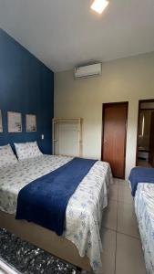 Giường trong phòng chung tại RECANTO DAS ÁGUAS VILLE