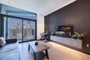 TV o dispositivi per l'intrattenimento presso Esclusive 1BR full Burj Khalifa View
