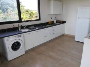 A kitchen or kitchenette at 3 bedroom vacation house with large pool