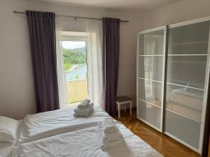 Posteľ alebo postele v izbe v ubytovaní Apartments Trlika