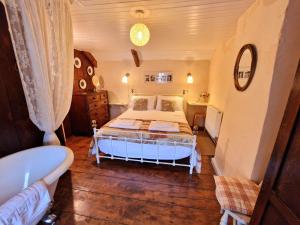 Ένα ή περισσότερα κρεβάτια σε δωμάτιο στο Arwel