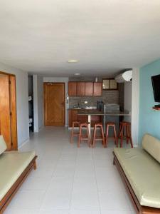 a kitchen with a table and chairs in a room at Apartamento 10c Edf.Playa in Santa Marta