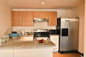 A kitchen or kitchenette at Infinity Pool Apartment