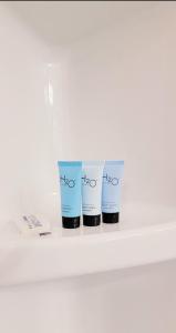 three cups on a shelf with the word hico on them at Amin residence in Atlanta