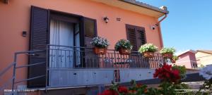 a balcony with potted plants on a building at Casa Francesca in Nicolosi +3 photos