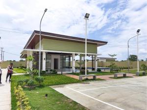 a building with people walking in front of it at KaribuBnb in Lapu Lapu City