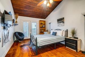 a bedroom with a bed with a wooden ceiling at Lago Vista Golf Getaway with Decks and Pool Access! in Lago Vista