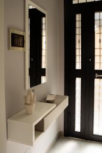 a bathroom with a sink and a mirror at App castle view Montefalcione in Montefalcione +26 photos