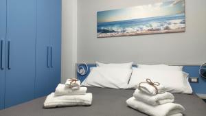 a bedroom with a bed with towels on it at App castle view Montefalcione in Montefalcione +27 photos