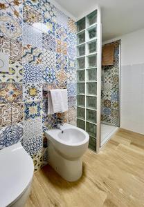 a bathroom with a toilet and a sink at La Stalla in Porto Santo Stefano