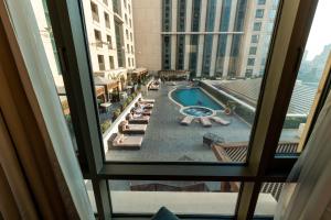 a view of a pool from a hotel window at the best charming condo on the Nile in Cairo