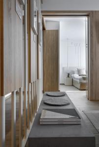 a hallway with a living room with a bed at Heritage & Tales: Sihna in Litochoro