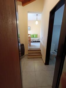 a hallway leading to a living room with a couch at Casas Altas VGB in Villa General Belgrano +27 photos