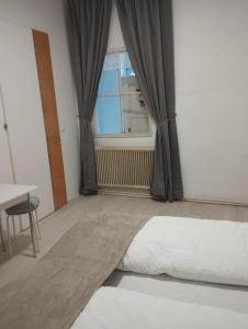 a bedroom with a bed and a window at RP-Stay in Vienna