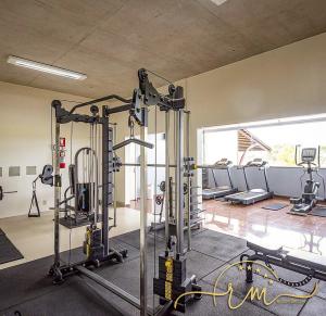 a gym with several tread machines in a room at diRoma Fiori RM Hospedagem in Caldas Novas
