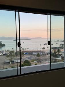a view of the ocean from a window at Casa Bela Vista in Angra dos Reis