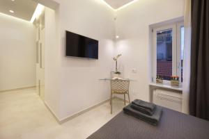 TV a/nebo společenská místnost v ubytování Surreo Luxury Bed & Breakfast