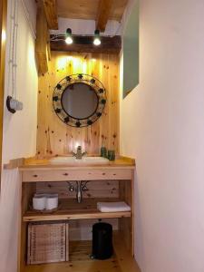 a bathroom with a sink and a mirror at Solpostada_Casa de pueblo reformada in Pobla de Masaluca +12 photos