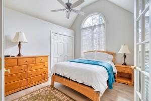 a bedroom with a bed and a dresser and a window at Welcome to the Kinglet's Nest, Spacious property with AC SHARC, Hot-tub, Bikes, Games, Grill, Golf and Pets in Sunriver +62 photos