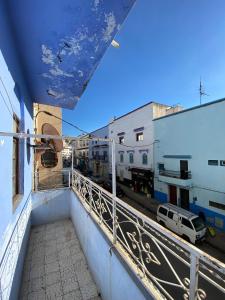 a balcony of a building with a view of a street at House blue pearl chefchaouen in Chefchaouen