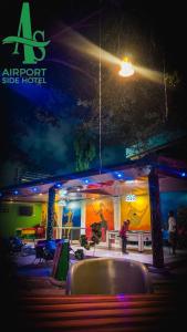 a stage with a sign that says airport side hotel at Airport Side Hotel in Accra +17 photos