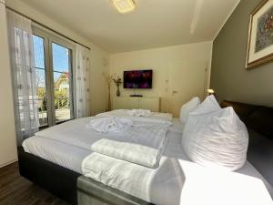 Postel nebo postele na pokoji v ubytování Haus Sonne