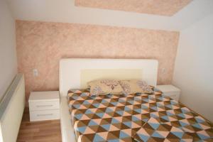 Postel nebo postele na pokoji v ubytování Apartman Nina