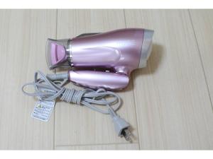 a pink blow dryer sitting on top of a table at La Mer Urayasu - Vacation STAY 11148 in Urayasu