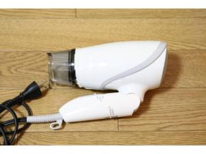 a white blow dryer on a wooden floor at Grandeur Imagawa - Vacation STAY 11149 in Urayasu