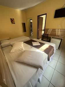 Postel nebo postele na pokoji v ubytování Recife Palace Hotel + 29 fotografií