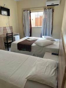 Postel nebo postele na pokoji v ubytování Recife Palace Hotel