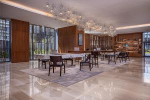 a dining room with a long table and chairs at JW Marriott Hotel Nairobi in Nairobi