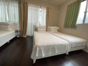 Postel nebo postele na pokoji v ubytování 名古屋车站整租度假House可停两台车生活便利