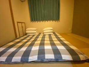 Postel nebo postele na pokoji v ubytování 名古屋车站整租度假House可停两台车生活便利