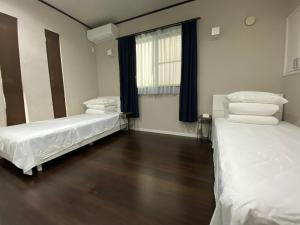 Postel nebo postele na pokoji v ubytování 名古屋车站整租度假House可停两台车生活便利