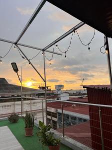 a view of the sunset from the roof of a building at Hotel Internacional de Colón in Colón