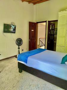 Postel nebo postele na pokoji v ubytování Casa Hotel Impacto