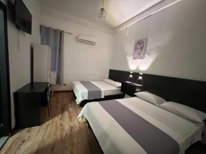 Cama ou camas em um quarto em Perla Suites Malecón